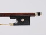 the bow is made of wood and has a silver tip