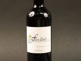 a bottle of wine that is sitting on a table