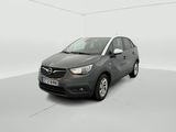 a grey car is parked in a white room with a white floor