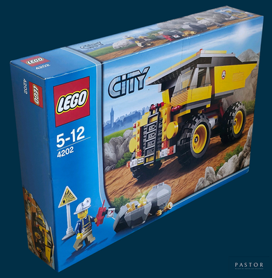 a box of lego city construction vehicles on a blue background