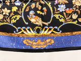 an image of a black and blue scarf with birds and flowers