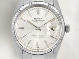 une photo d'une montre Rolex à cadran blanc montée sur un bracelet