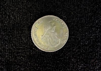 a coin with a picture of a woman on it