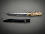 a close up of a knife and a knife holder on a table