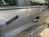 a sticker on the door of a car that has a sticker on it