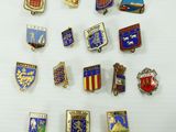 some of the badges are on display on a white surface