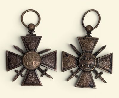 pair of bronze crosses with swords and cross heads on them