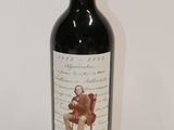 a bottle of wine that is sitting on a table