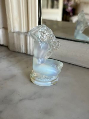 a glass duck that is sitting on a counter
