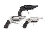 two revolvers are shown on a white surface with a white background