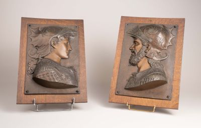pair of bronze busts of a man and a woman