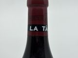 a bottle of wine that is sitting on a table