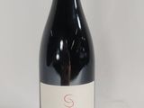 a bottle of wine that is sitting on a table