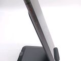 a close up of a cell phone on a stand