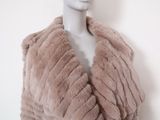 the mannequin is wearing a fur coat on a mannequin head