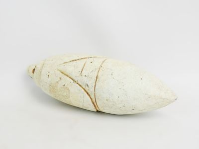 an image of a white stone object on a white surface