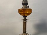 a small oil lamp that is sitting on a table