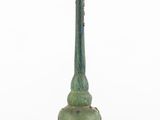 a green vase that is sitting on a white surface