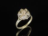 a close up of a diamond ring on a black surface