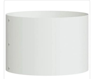 a close up of a white lamp shade on a table