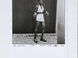 black and white photograph of a woman holding a tennis racquet