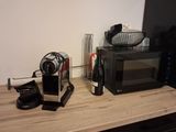 a picture of a kitchen counter with a microwave and a coffee maker
