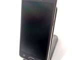a cell phone that is sitting on top of a stand
