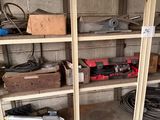 a shelf with tools and tools on it in a garage