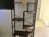 a shelf that has a tv on it in a room