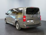a silver van that is parked in a room