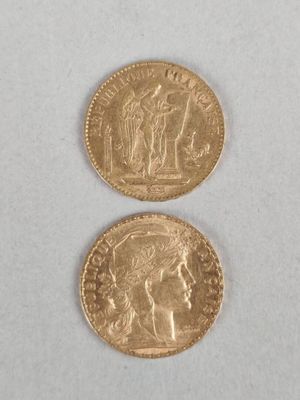 two gold coins with a woman and a man on them