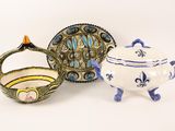 three different pieces of pottery sitting on a white surface