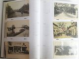 an open book with pictures of people and buildings in it