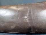 a close up of a piece of leather on a chair