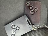 a metal buckle on a piece of luggage that is attached to the back of a bag