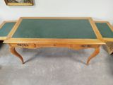 an image of a desk with a green top