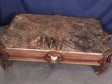 a marble top coffee table with a wooden base