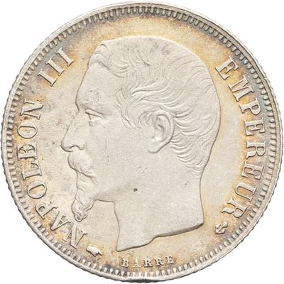 Gros plan sur une pièce de monnaie portant le visage d'un homme