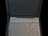 a open suitcase that has several pieces of paper inside of it