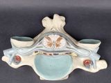 a picture of a ceramic sculpture of a woman ' s head