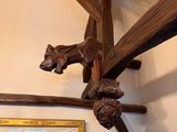 a picture of a wooden sculpture of a horse on a wall