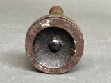 a small metal object that is sitting on a table