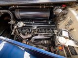a close up of the engine of a blue car