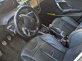 a picture of the interior of a car with a steering wheel