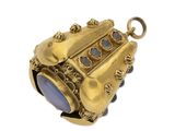 an antique gold locke with a blue stone in the center