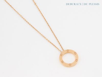 a close up of a necklace on a white surface