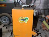 a machine that is sitting on a pallet in a garage