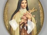 a picture of a picture of a woman holding a cross