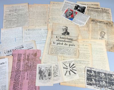 several old french newspapers are stacked on top of each other