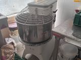 an image of a kitchen with a mixer and other items
